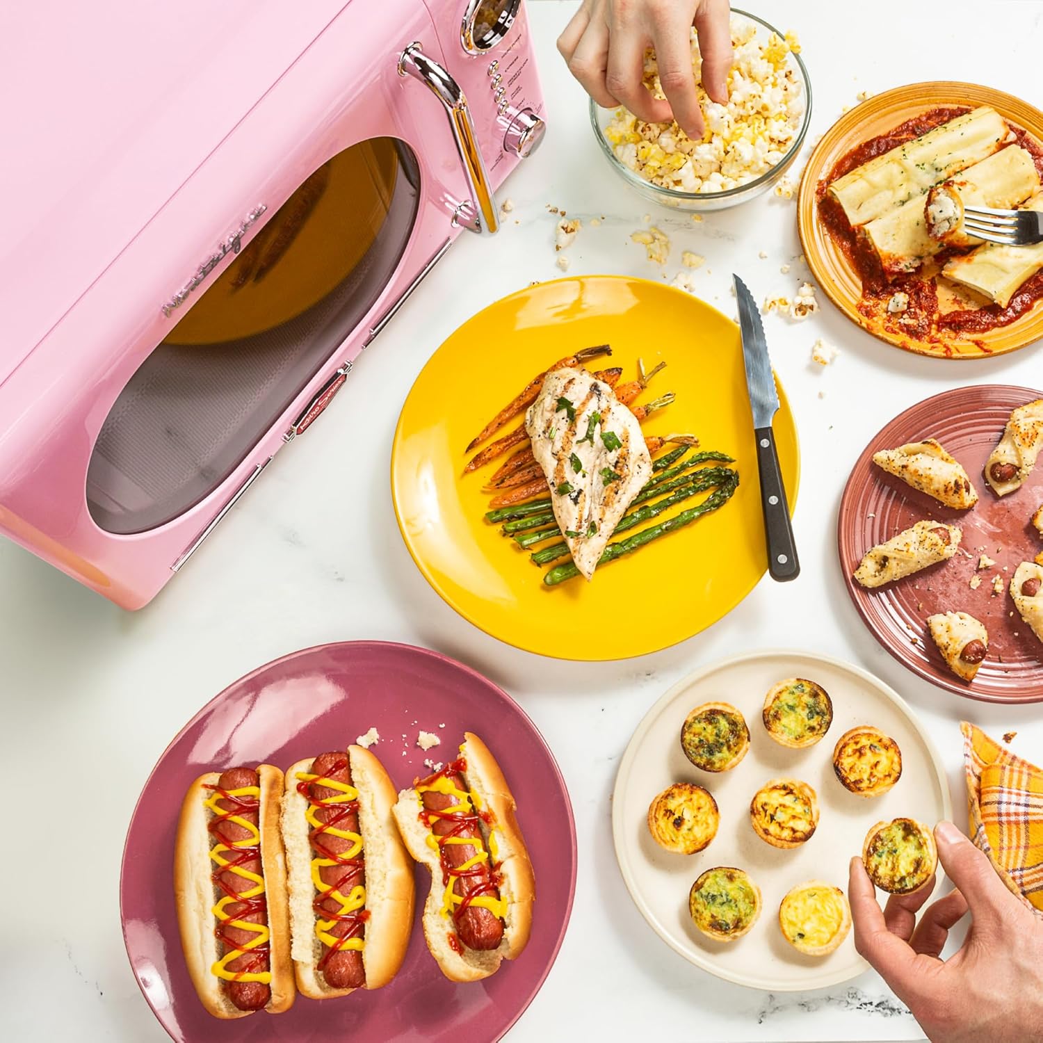 Nostalgia Countertop Microwave Oven with Easy Clean Interior - Retro Microwave with LED Display & Child Lock- Compact 0.7 Cu. Ft. Oven With 12 Pre-Programmed Settings for Quick Cooking- 700-Watts-Pink
